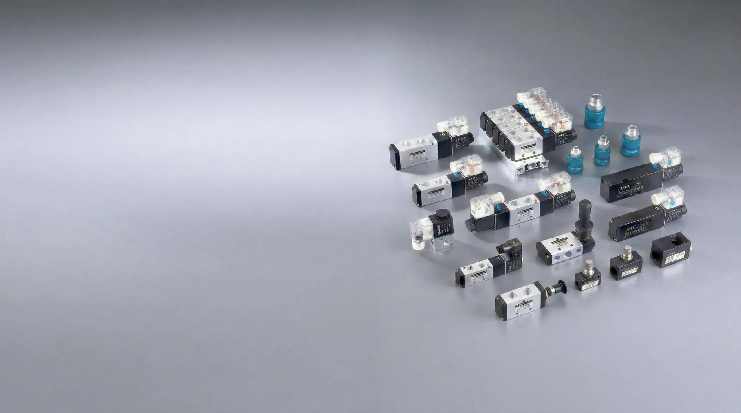 Representative source arrangement of directional valves, coils, manual operators and a manifold